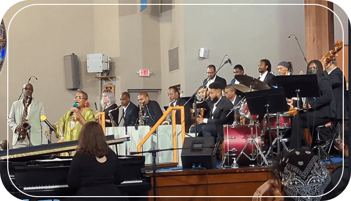 A group of people in suits and hats playing instruments.